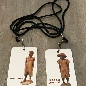 Photo of two Whitney Plantation tickets with lanyards.
